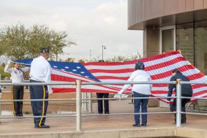 ￼Flag Breathing Ceremony Honors Fallen Service Members of Pearl Harbor Attacks