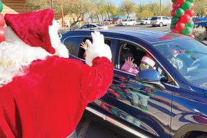 Santa Stops by SRS Food Service Meal Distribution Drive-Thru