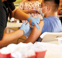 Youth Receive the COVID-19 Vaccination at Vaccine Clinic