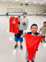 Students Receive School Supplies Before Class Resumes Session 